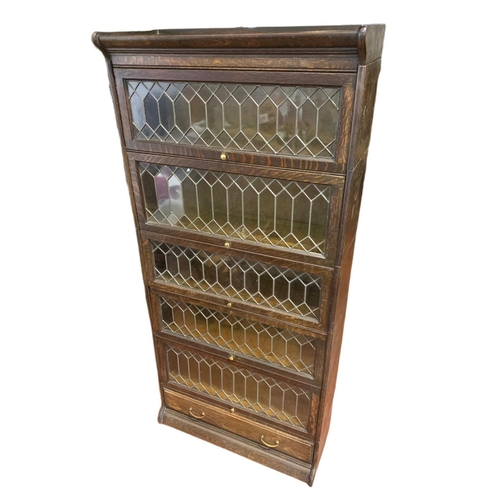 877 - Large Edwardian stacking bookcase with drawer by Gumm. 86.5/36/188cm