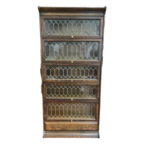 877 - Large Edwardian stacking bookcase with drawer by Gumm. 86.5/36/188cm