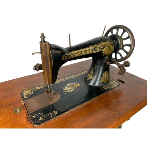 897 - Early 20th century singer sewing machine table. 79/42/101cm