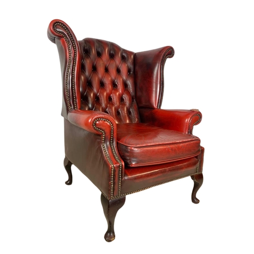 898 - Vintage deep button leather wingback armchair