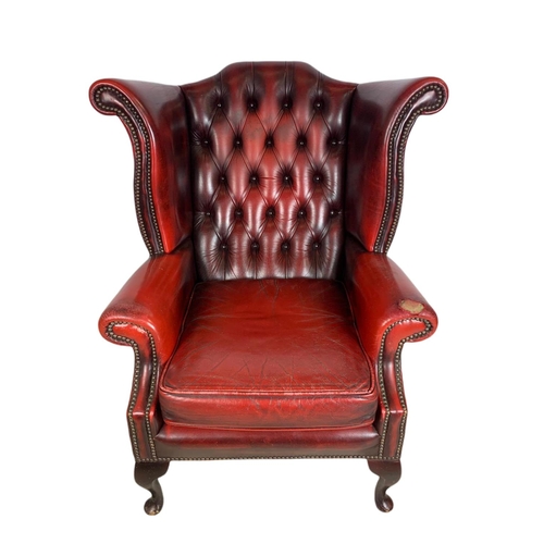 898 - Vintage deep button leather wingback armchair