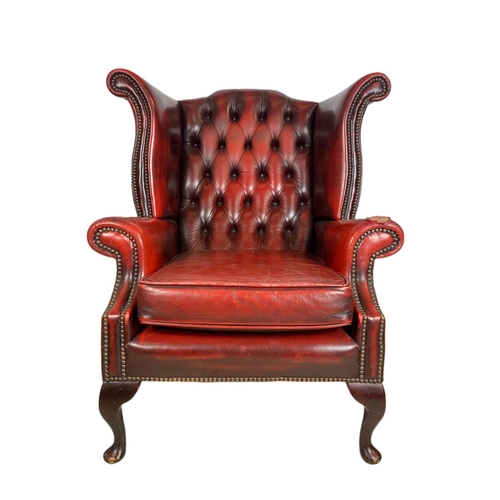 898 - Vintage deep button leather wingback armchair