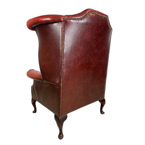 898 - Vintage deep button leather wingback armchair