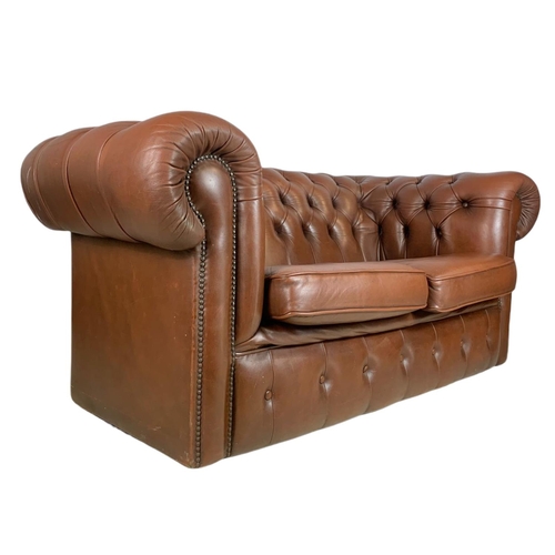 906 - 2 seater leather Chesterfield club sofa. 156cm