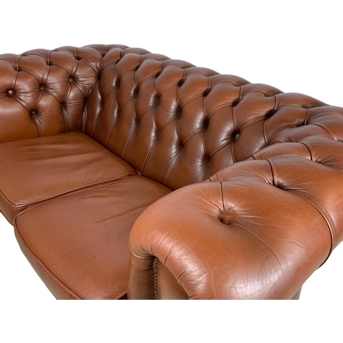 906 - 2 seater leather Chesterfield club sofa. 156cm