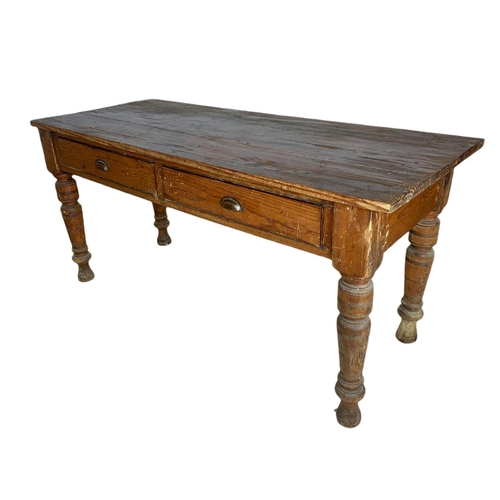 907 - Victorian pitch pine 2 drawer farmhouse table. 163/67/78cm