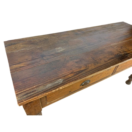 907 - Victorian pitch pine 2 drawer farmhouse table. 163/67/78cm