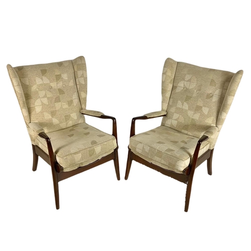 946 - Pair of mid century vintage Cintique wingback armchairs