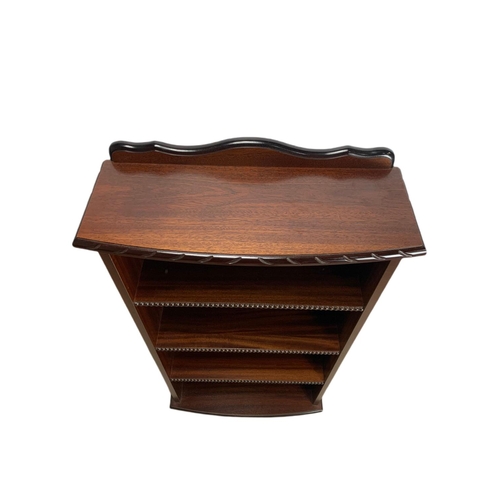 809 - Mahogany shelving unit and an inlaid nest of tables. 59/22/117.5cm