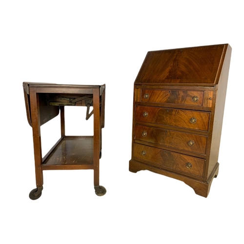 810 - Mahogany Georgian style writing bureau and a vintage drop leaf serving trolley. Bureau 57/41/97cm.