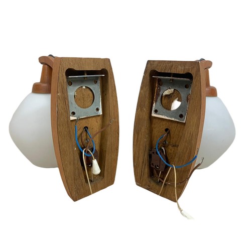 357 - Pair of teak mid century wall lights with glass shades. 20/19cm