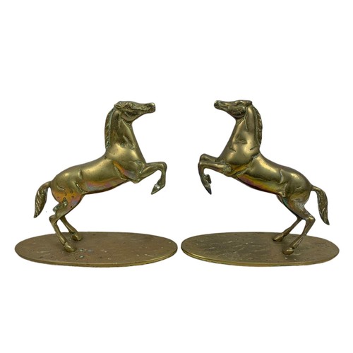 584 - Pair of heavy brass horses. 22/20cm