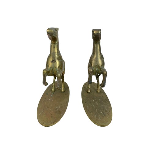 584 - Pair of heavy brass horses. 22/20cm