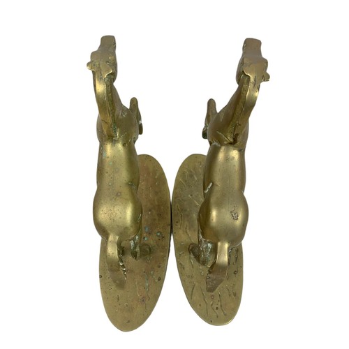 584 - Pair of heavy brass horses. 22/20cm