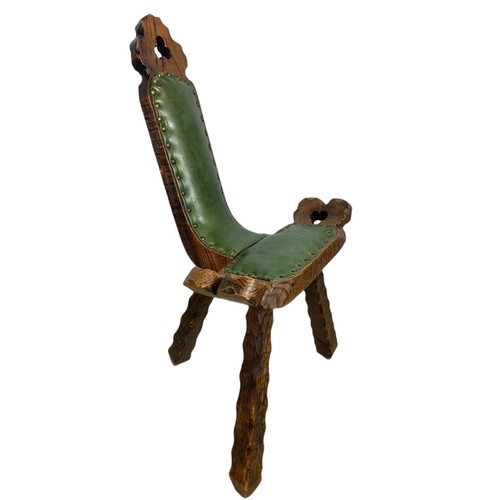 819 - Small carved oak camel chair with leather. 45/42/79cm