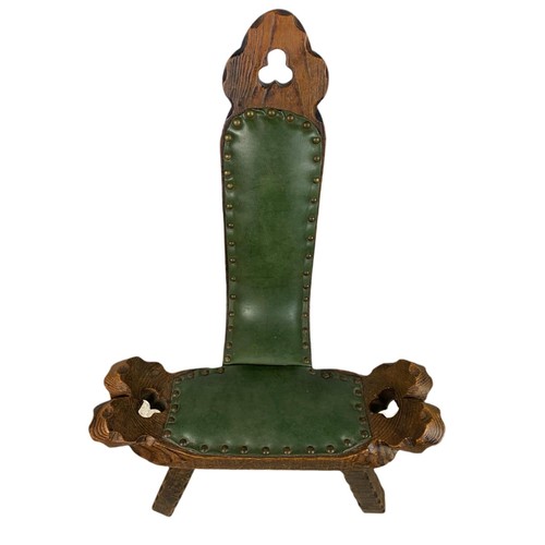 819 - Small carved oak camel chair with leather. 45/42/79cm