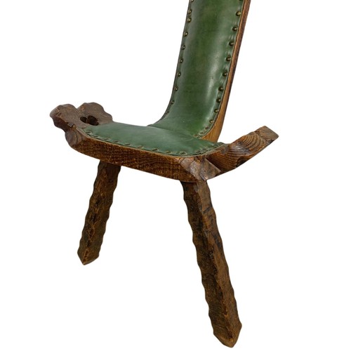 819 - Small carved oak camel chair with leather. 45/42/79cm