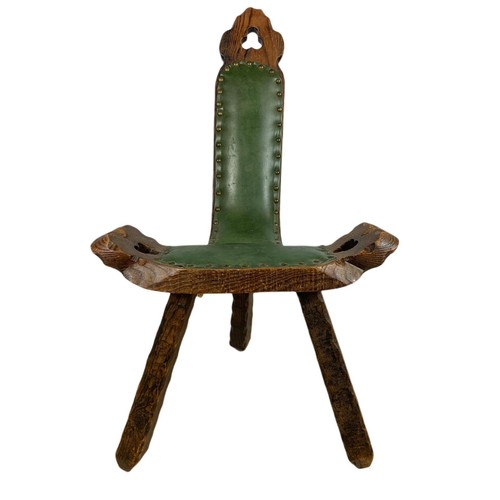 819 - Small carved oak camel chair with leather. 45/42/79cm