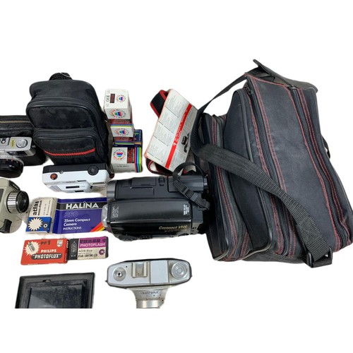 214b - Quantity of cameras and accessories. Including a compact VHS JVC camcorder in case, Halina camera wi... 