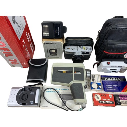 214b - Quantity of cameras and accessories. Including a compact VHS JVC camcorder in case, Halina camera wi... 