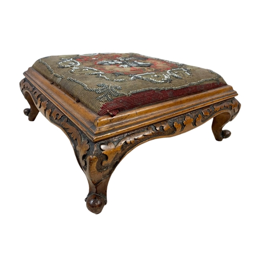 977 - Pair of Victorian carved walnut footstools on cabriole legs with original bead work. 35/35/15.