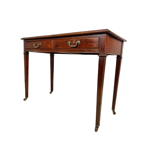 1010 - Edwardian oak leather top 2 drawer writing table. 107/49/76.5c