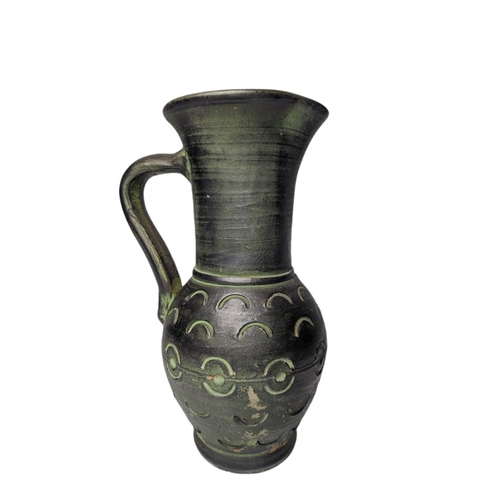 135a - Large glazed Terracotta jug. 29cm