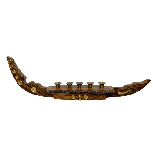 156a - Vintage rosewood and brass candle holder in the shape of a gondola. 52cm