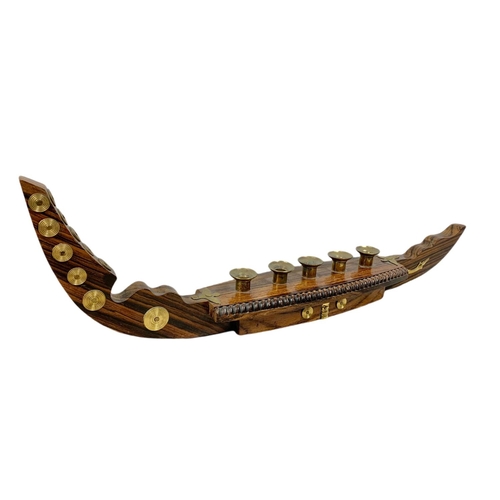 156a - Vintage rosewood and brass candle holder in the shape of a gondola. 52cm