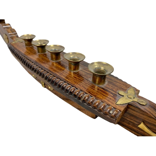 156a - Vintage rosewood and brass candle holder in the shape of a gondola. 52cm