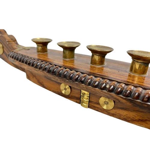 156a - Vintage rosewood and brass candle holder in the shape of a gondola. 52cm