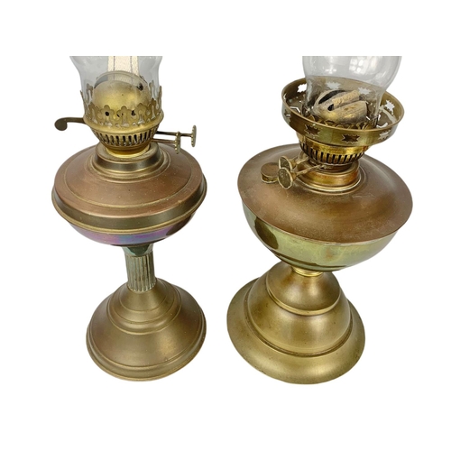 217a - 2 early 20th century brass oil lamps. 54cm.