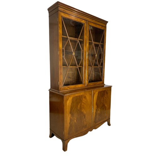 992 - Large Regency style inlaid mahogany bookcase. 110/44/195cm