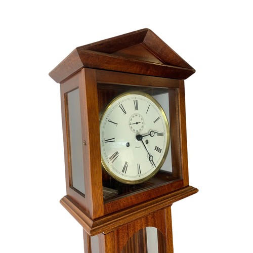 1040 - Large mahogany German wall clock. With key, weights and pendulum. 154cm