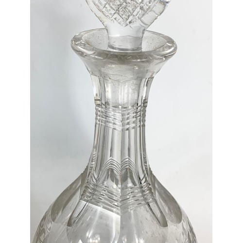 629 - Victorian cut glass etched decanter and an Edwardian decanter. 31cm