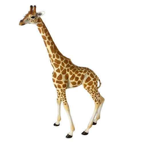 776 - 3 dolls and a large giraffe ornament. Largest 44cm