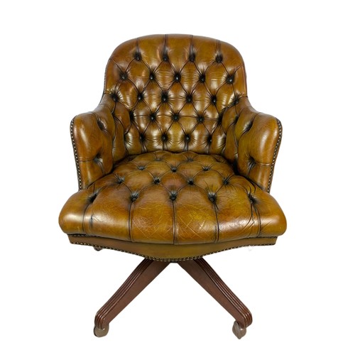 910 - Vintage Victorian style deep button leather swivel chair.