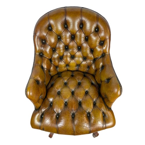 910 - Vintage Victorian style deep button leather swivel chair.