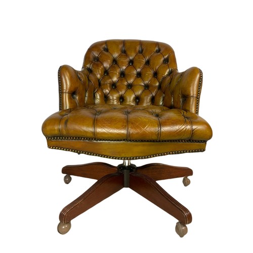 910 - Vintage Victorian style deep button leather swivel chair.