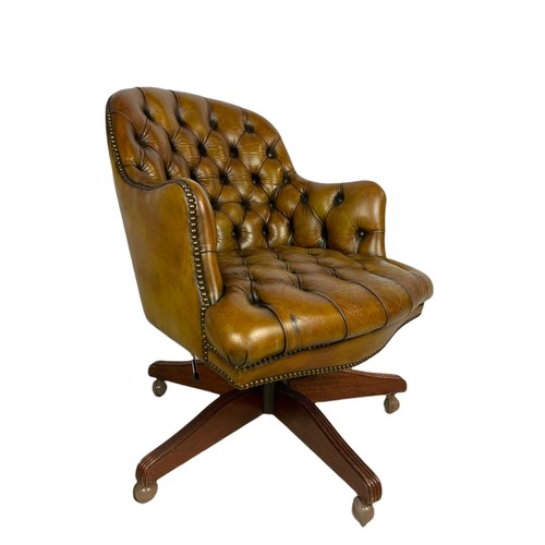 910 - Vintage Victorian style deep button leather swivel chair.