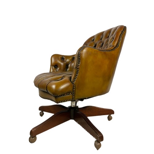 910 - Vintage Victorian style deep button leather swivel chair.