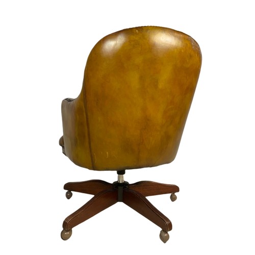 910 - Vintage Victorian style deep button leather swivel chair.