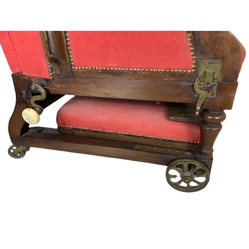 935 - A Victorian mahogany convalescence armchair by John Ward, London, 1880/1900. 76/79/107cm.