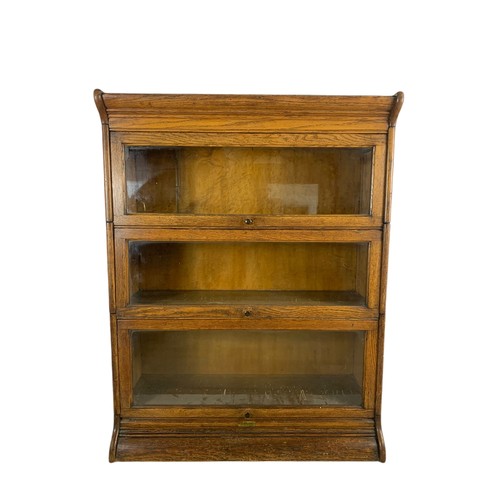 1007 - Edwardian oak stacking bookcase. 87/34/118cm