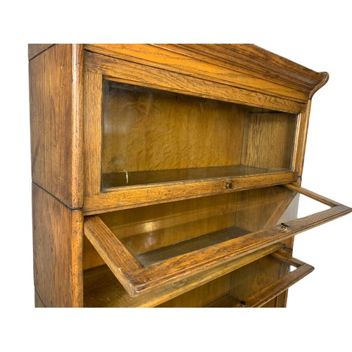 1007 - Edwardian oak stacking bookcase. 87/34/118cm