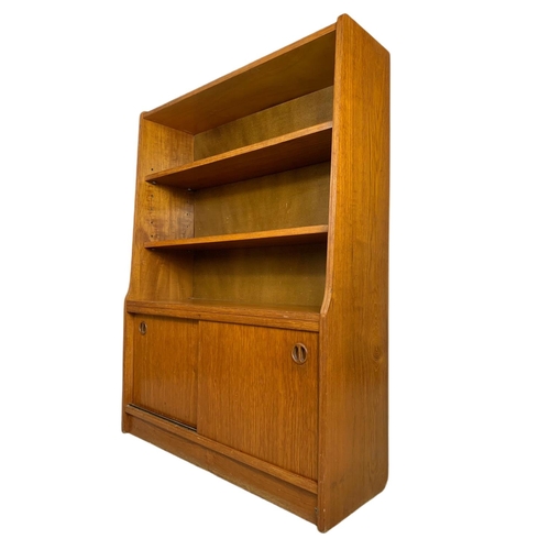 1049 - Danish teak mid century bookcase. 91/30/121cm