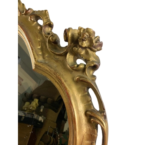 1050 - Victorian gilt framed mirror with original gilding. 66/97cm