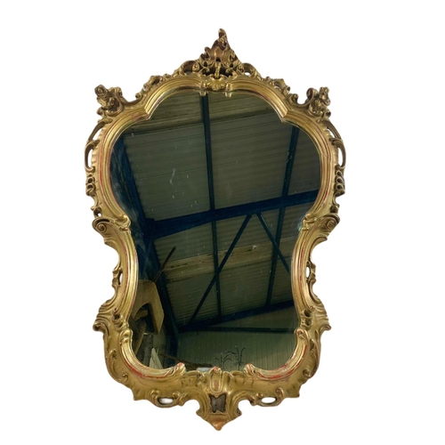 1050 - Victorian gilt framed mirror with original gilding. 66/97cm