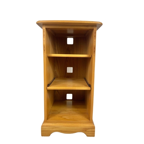 1068 - Blonde Ercol shelving unit with slide out shelf. 43/45/82cm