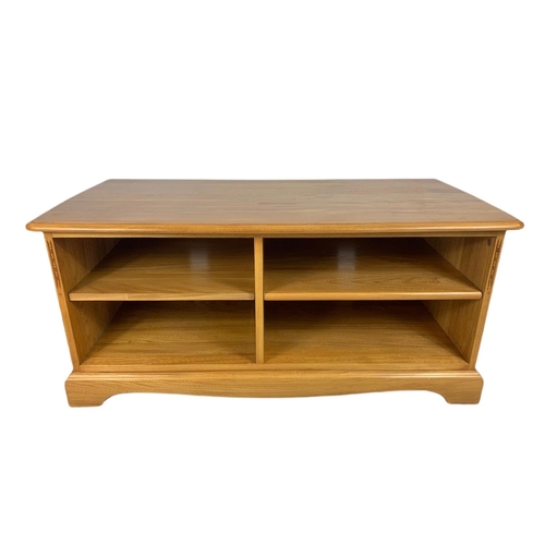 1069 - Blonde Ercol TV/side unit. 119/51.5/49.5cm